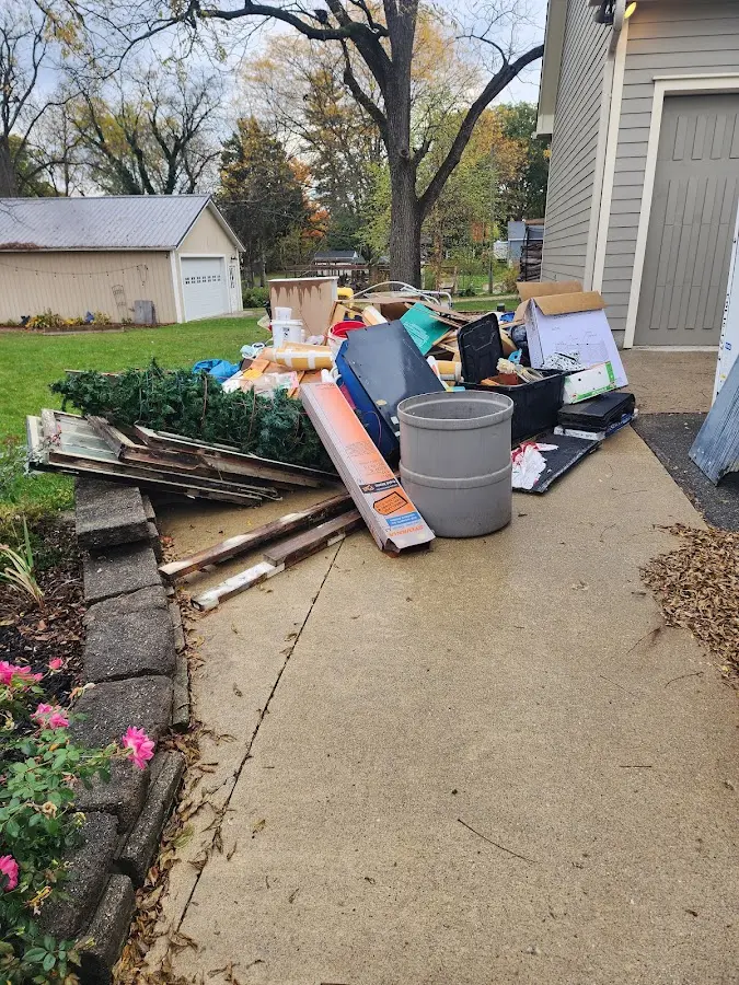 Dumpster being loaded with debris for Commercial Dumpster Rental in Omak